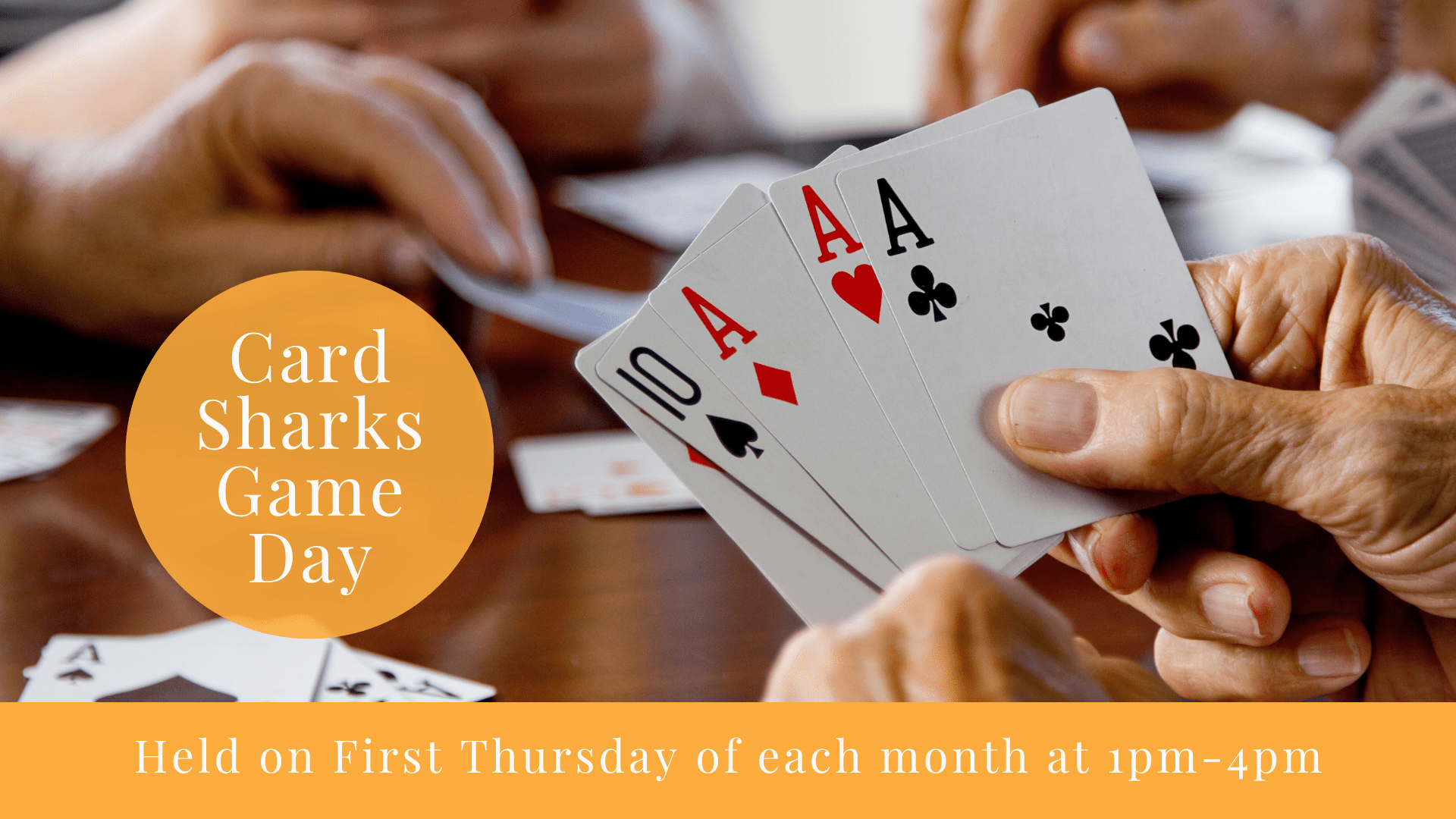 Hands holding playing cards on a table with lettering about Card Sharks Game Day